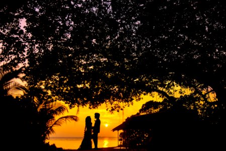 Silhouette Photo Of Man And Woman During Sunset photo