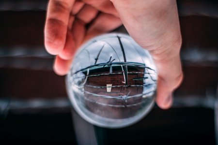 Person Holding Glass Ball photo