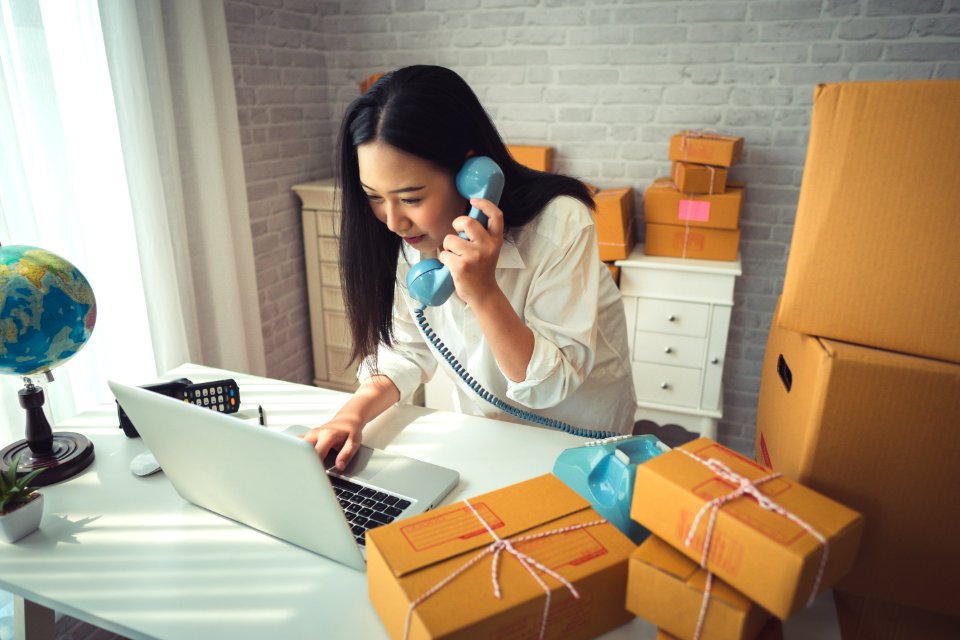 Woman Holding Gray Laptop Computer