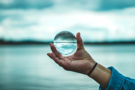 Person Holding Crystal Ball