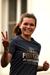 Woman Running Wearing Gray Shirt photo