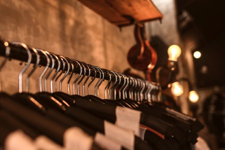 Photo Of Black Clothes On Hangers photo