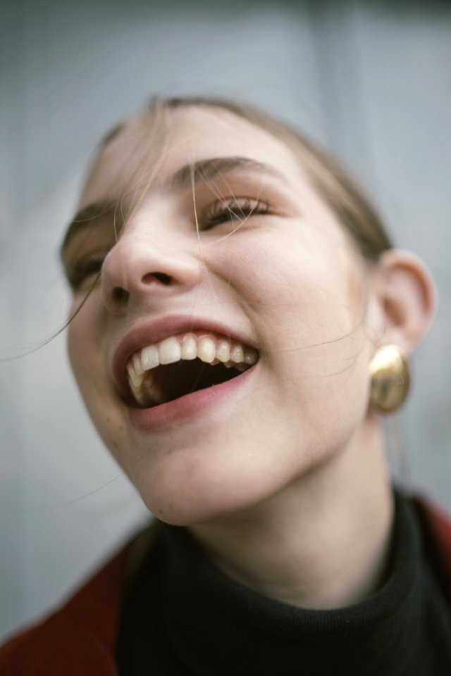 Close-Up Photography Of A Laughing Woman photo