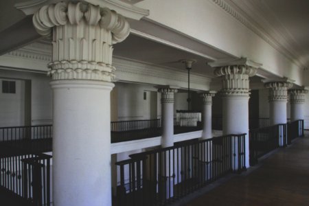 Photo Of White Columns Near Railings photo