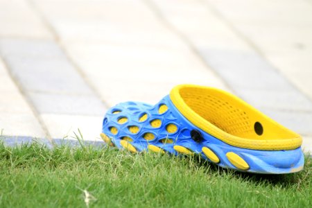 Close-up Photography Of Rubber Clog