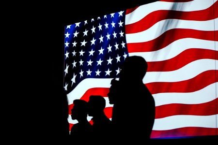 Silhouette Of Four Person With Flag Of United States Background photo
