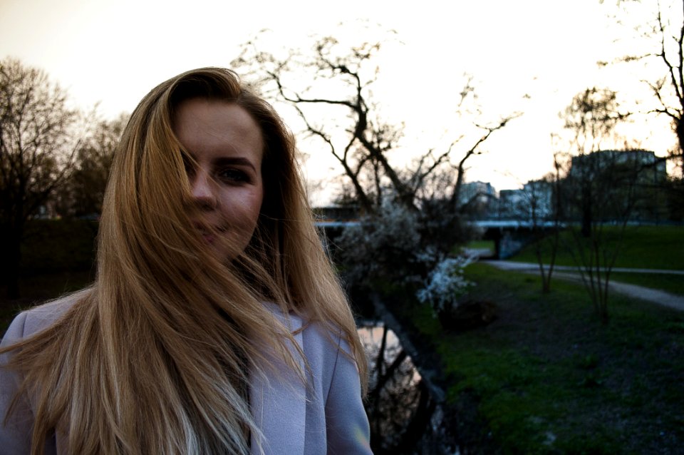 Woman Wearing White Winter Coat While Taking Selfie