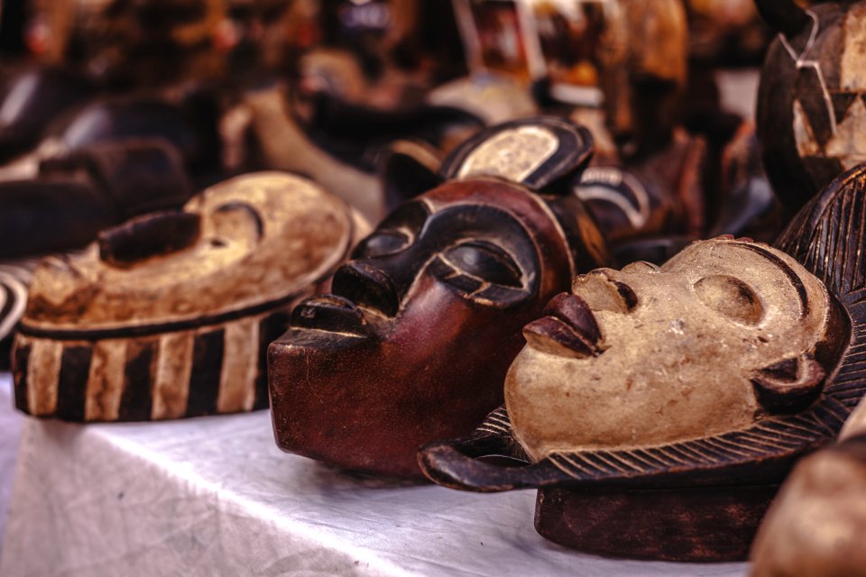 Selective Focus Photography Of Mask Sculpture