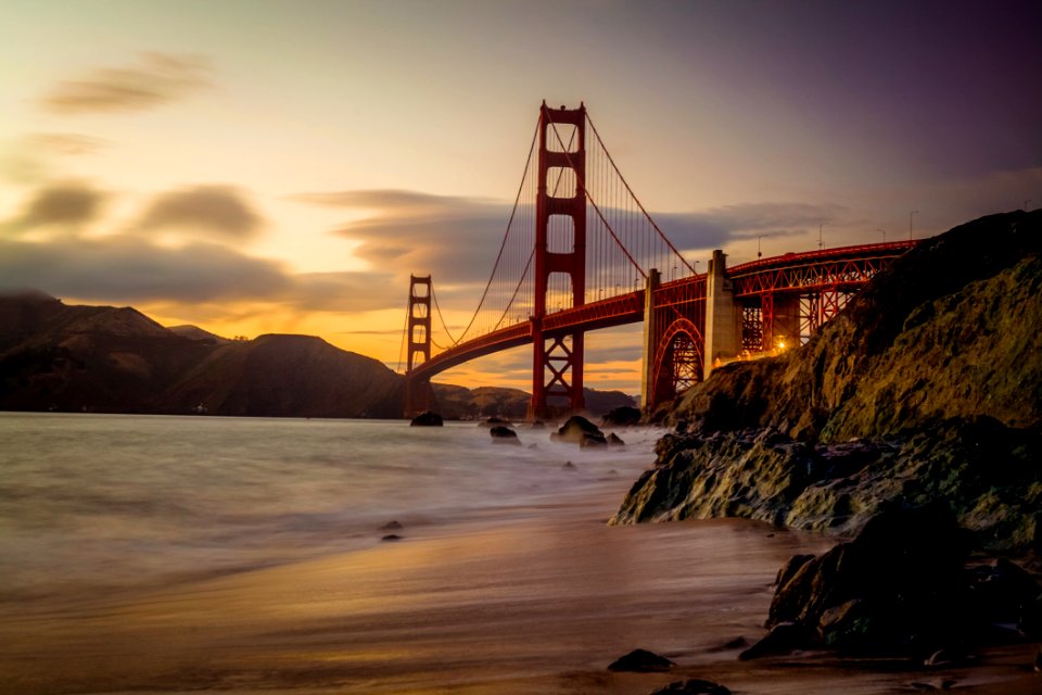 Photography Of Red Bridge Under White And Gray Sky
