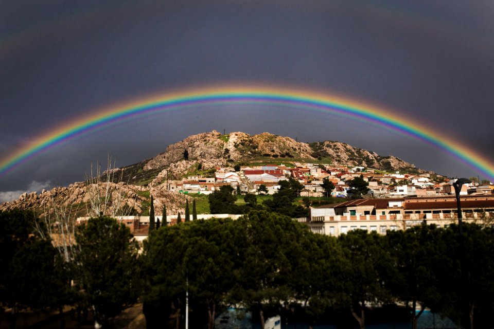 Landscape Photo Of The View Of City With Rainbow Above