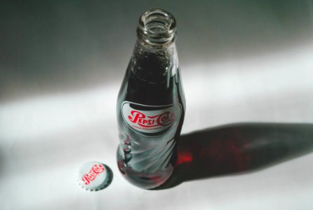 Pepsi-cola Soda Bottle On White Surface photo