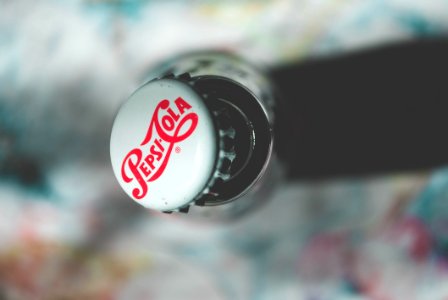 Shallow Focus Photography Of Pepsi-cola Bottle Cap photo