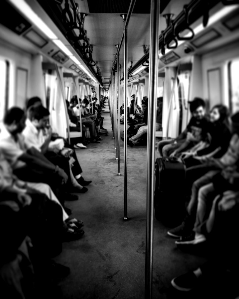 Grayscale Photography Of Train Passengers photo
