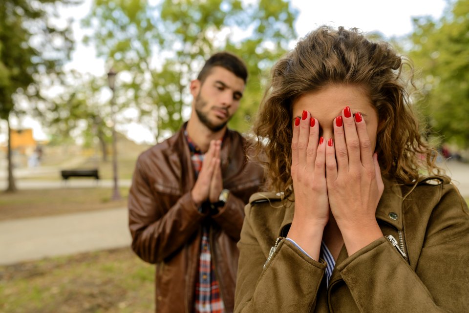 Woman With Green Jacket Behind Man With Brown Leather Jacket At Daytime