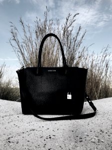 Black Michael Kors Leather 2-way Bag On Gray Surface photo