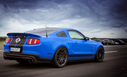 Blue Sports Coupe On Road photo