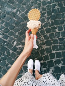 Person Holding Ice Cream In Cone photo