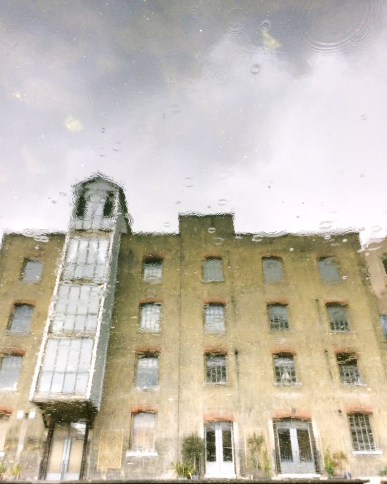 Brown And Gray Building Water Reflection