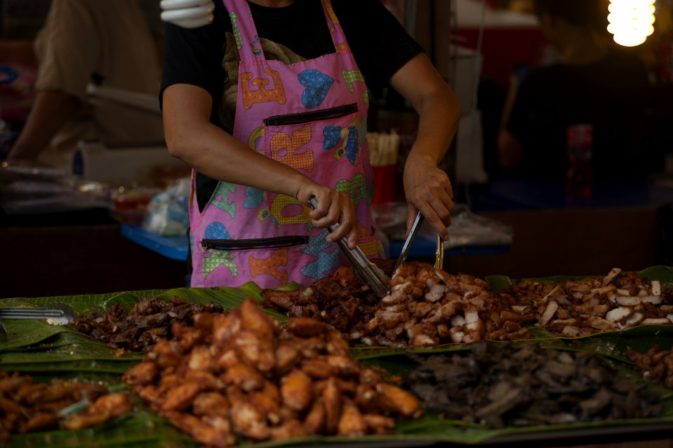 Person Wearing Pink And Multicolored Apron