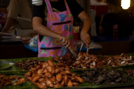 Person Wearing Pink And Multicolored Apron