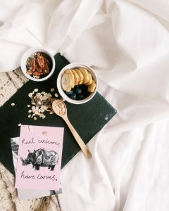 Flat Lay Photography Of Brown Wooden Ladle Beside White Bowl With Sliced Fruits