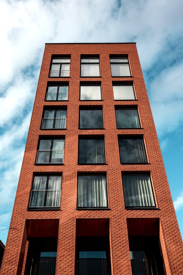 Red And Black Concrete High-rise Building