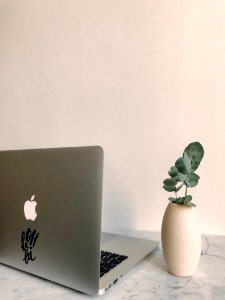 Photo Of Macbook On Granite Desk photo