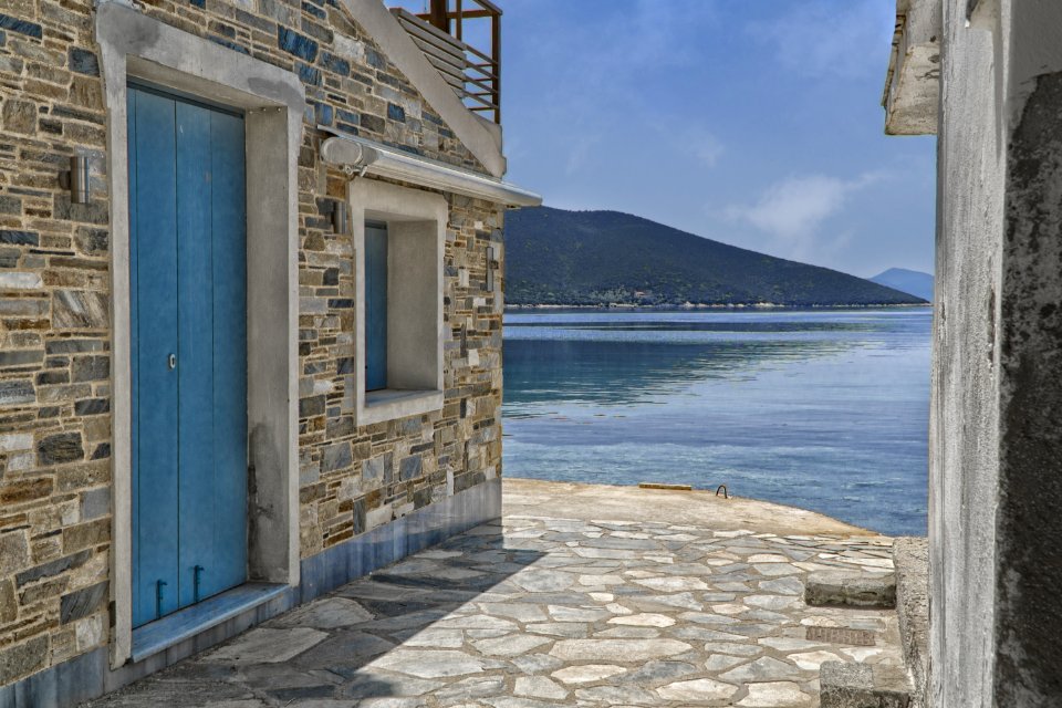 Gray Concrete Houses Near Body Of Water