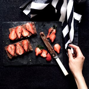 Slices Strawberries On Chopping Board photo