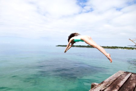 Photo Of Woman Diving Into The Water photo