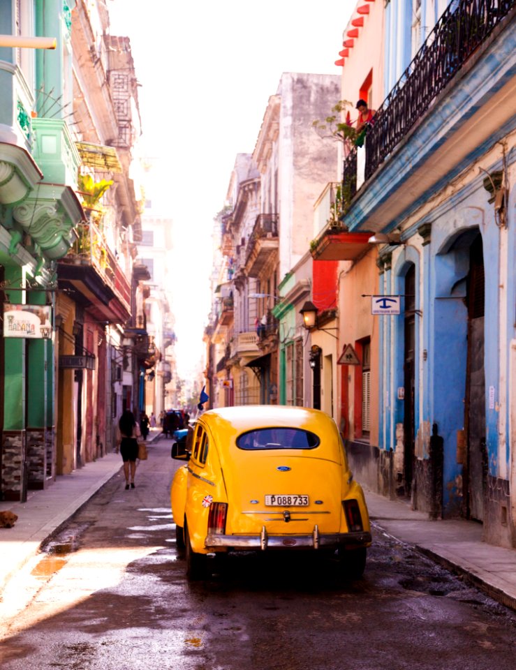Photography Of Yellow Car On Alley