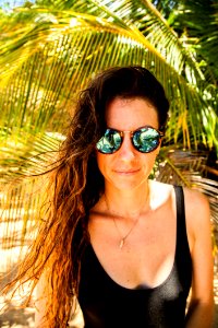 Photography Of A Woman Wearing Sunglasses photo