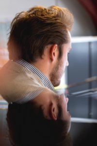 Photo Of Man Wearing Beige Top With Reflection In Mirror photo