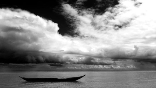 Grayscale Photo Of Black Boat