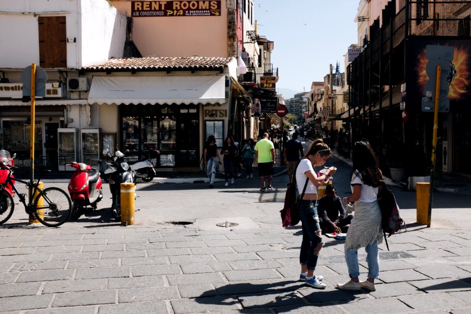 People Near A Brown Building At Daytime