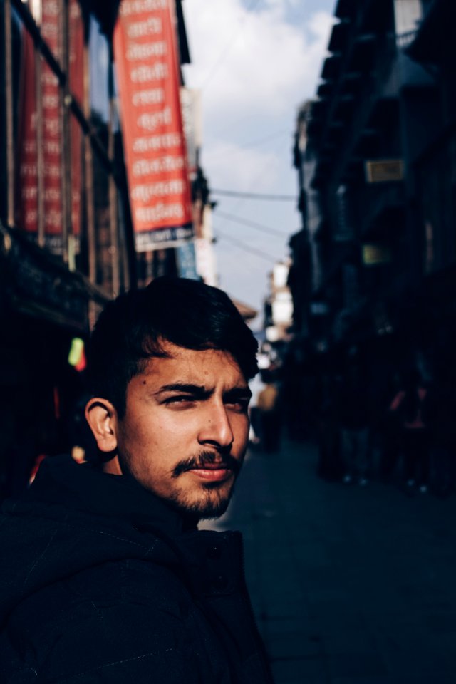 Selective Focus Photography Of Man Wearing Black Top photo