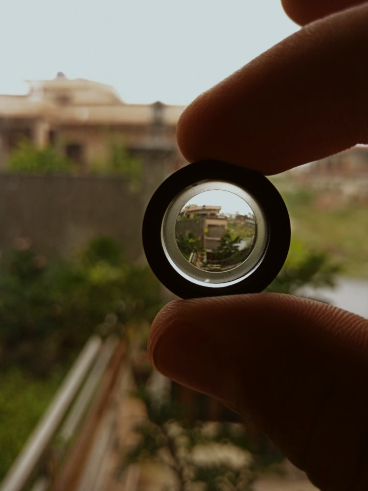 Person Holding Black Lens