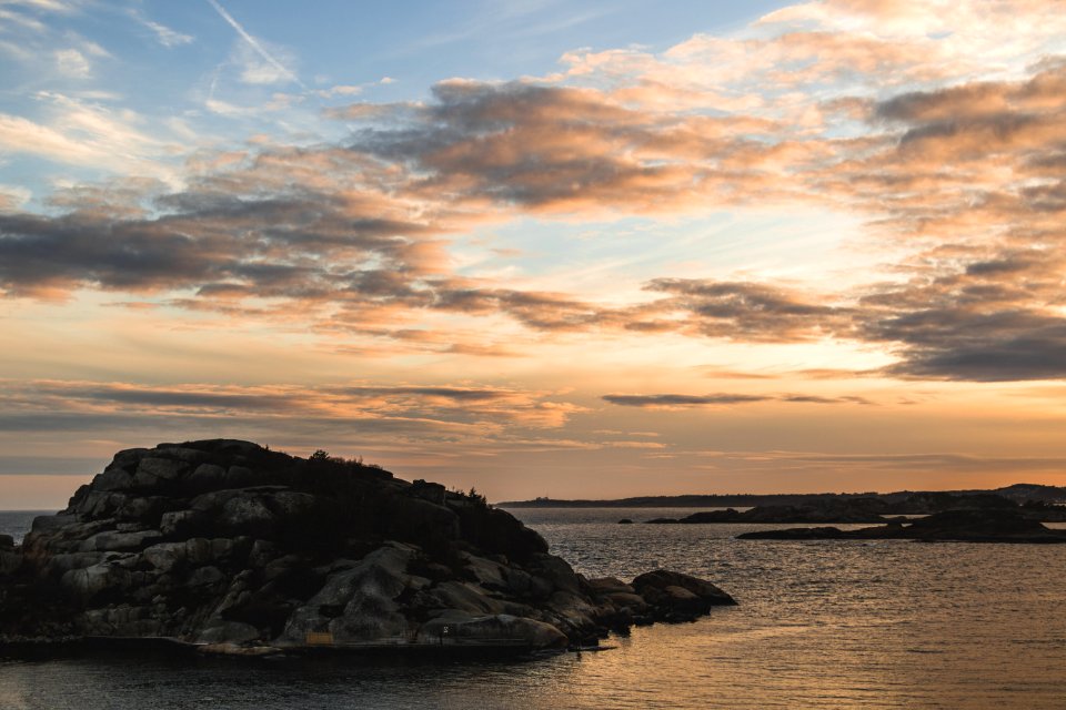 Body Of Water With Rock On Center Photo