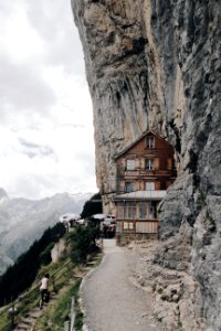 Brown Wooden House On Edge Of Cliff photo