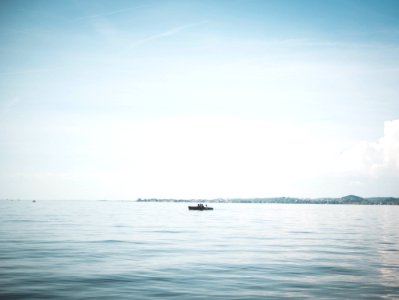 Boat On Calm Body Of Water photo