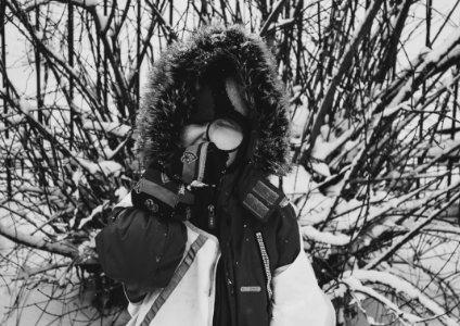 Greyscale Photo Of Woman With Snowsuit photo