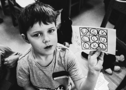 Boy Holding Paper With Text