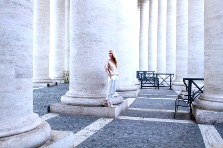 Woman Standing Concrete Pilar Building photo