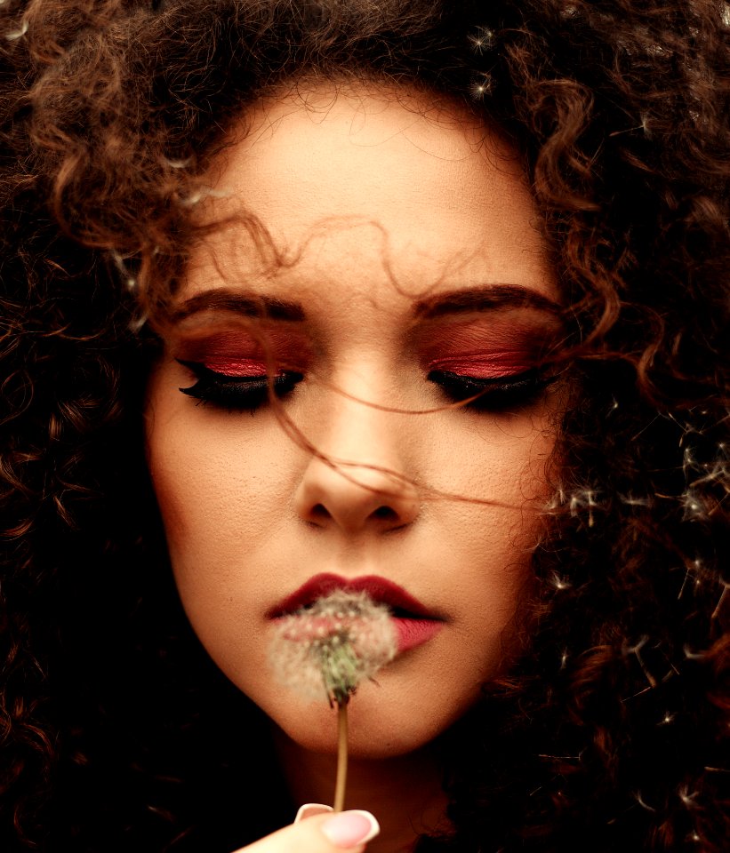 Close-Up Photo Of Woman Holding Dandelion Flower