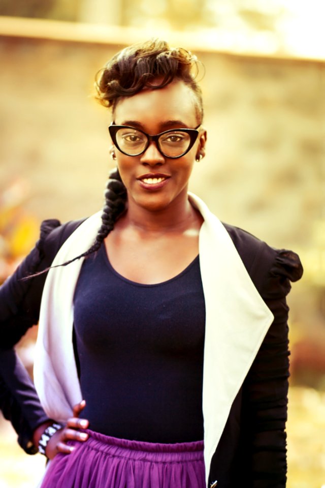 Woman Wearing Purple Tank Top And Black Suit Jacket