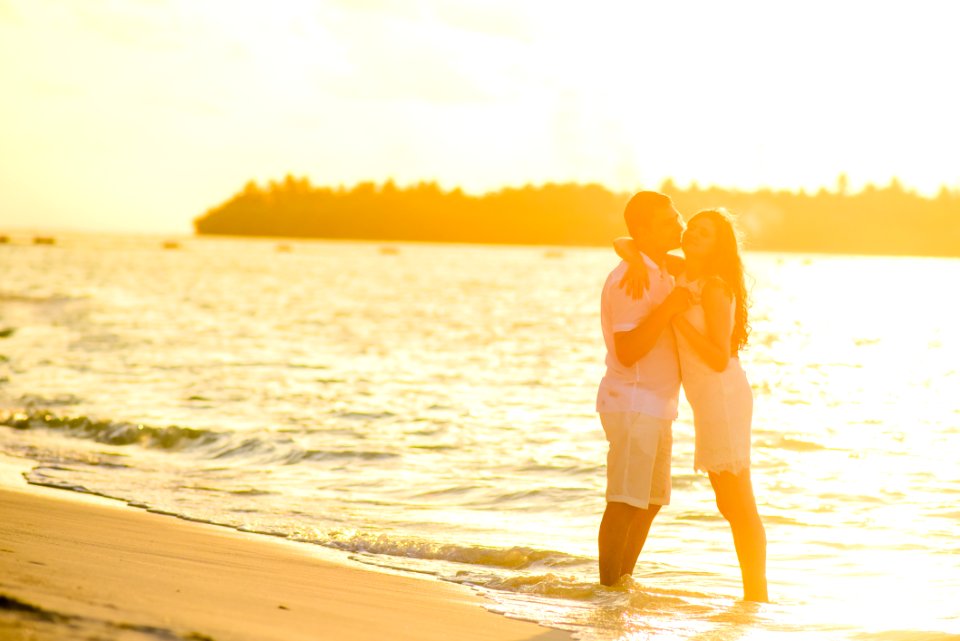 Hugging Woman And Man In Beach