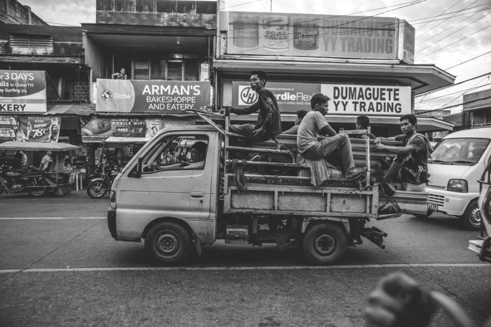 Grayscale Photo Of Men Riding On Kei Truck
