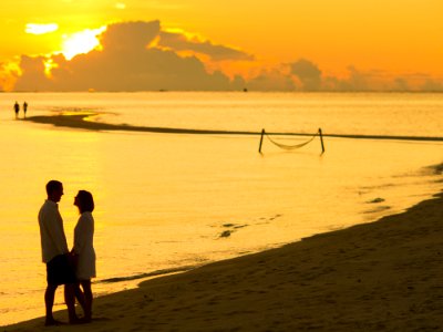 Man And Woman Facing Each Other In Front Of Golden Hour photo