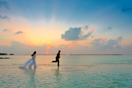 Man And Woman Standing At Seashore photo