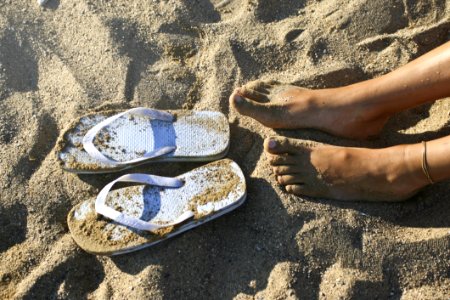 Photography Of A Girls Feet Near Flip-flops